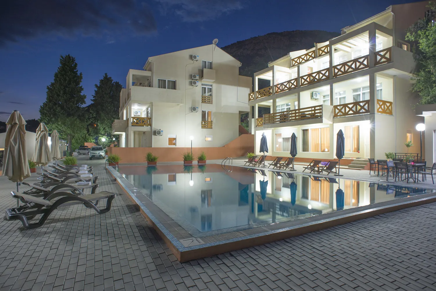 Apartment buildings and pool at dusk
